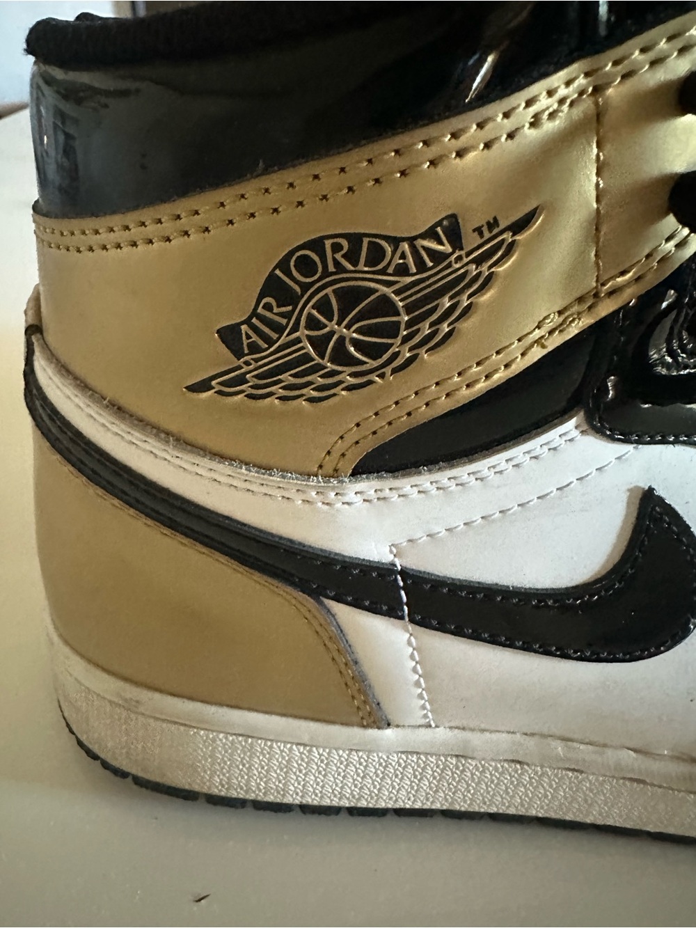 Jordan Men’s High-Top Sneakers in Gold, Black & White